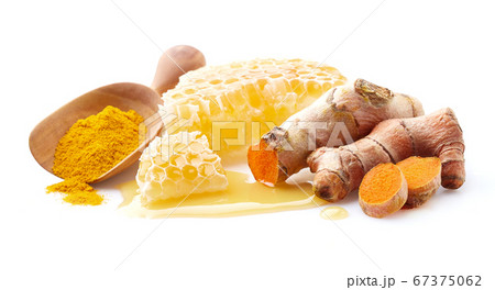 Honeycombs with turmeric root on white background Honeycombs with turmeric root on white background 67375062
