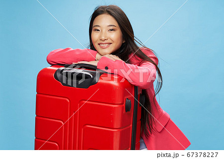 woman with red suitcase on isolated background go on a trip woman with red suitcase on isolated background go on a trip 67378227