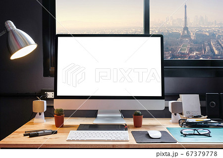 Graphic designer's workspace with cityscape view Graphic designer's workspace with cityscape view 67379778