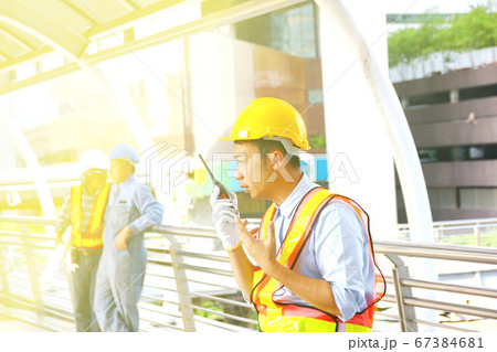 the engineer using radio in hand talk to the team the engineer using radio in hand talk to the team 67384681