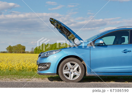 Broken car on the road with open hood. Trouble Broken car on the road with open hood. Trouble 67386590
