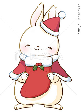 にっこり笑顔の白いうさぎとクリスマス 大きな靴下 のイラスト素材