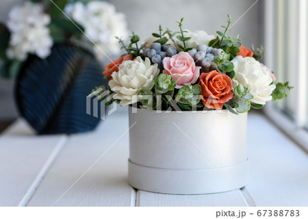 Bouquet of beautiful bright rose flowers in a gift Bouquet of beautiful bright rose flowers in a gift 67388783