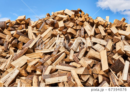 huge pile of firewood against the sky 67394076
