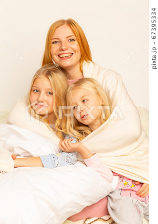Young little schoolboy doing homework with mother, cooperation in family, parenthood Young little schoolboy doing homework with mother, cooperation in family, parenthood 67395334