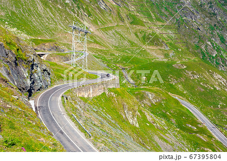 winding mountain road on a sunny day. empty winding mountain road on a sunny day. empty 67395804