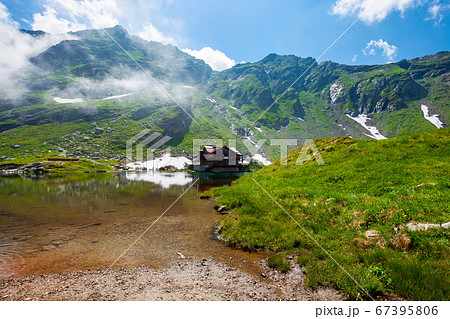 clouds above balea lake in romania. stunning clouds above balea lake in romania. stunning 67395806