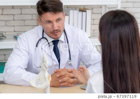 Doctor in professional uniform examining patient at hospital Doctor in professional uniform examining patient at hospital 67397119