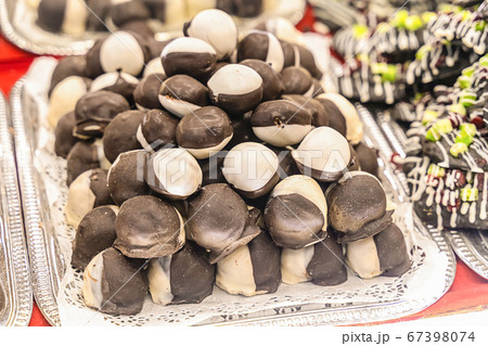 chocolate covered black and white marzipan piled chocolate covered black and white marzipan piled 67398074