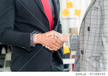 Business people handshake in corporate office Business people handshake in corporate office 67398430