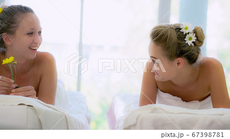 Two women at massage room in luxury day spa. 67398781
