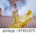 Woman wearing typical thai dress with thai style, Beauty fantasy Thai dress traditional costume on brick in old temple 67401973