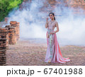 Woman wearing typical thai dress with thai style, Beauty fantasy Thai dress traditional costume on brick in old temple 67401988