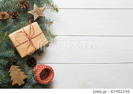 Christmas craft gift, wooden diy, evegreen fir tree on wooden board. Top view. Christmas craft gift, wooden diy, evegreen fir tree on wooden board. Top view. 67402246