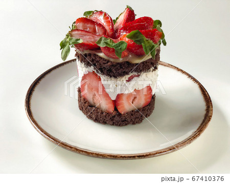 strawberry and chocolate cake on a table strawberry and chocolate cake on a table 67410376