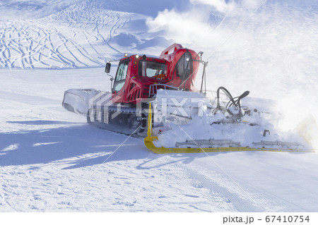 Snowplow clears tracks in the ski resort of the Snowplow clears tracks in the ski resort of the 67410754