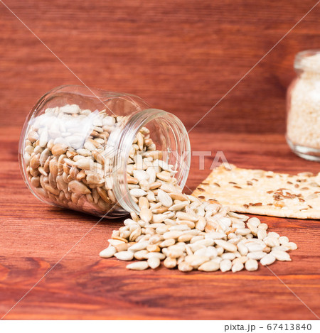 sunflower seeds in a jar with  crispy wheat cakes 67413840