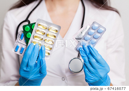 Doctor holds a pill for men's sexual health Doctor holds a pill for men's sexual health 67416077