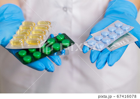 Doctor holds a pill for men's sexual health Doctor holds a pill for men's sexual health 67416078