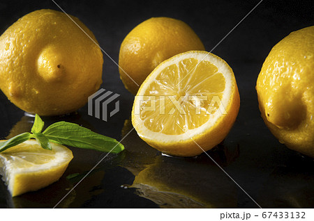lemons on a wet black with reflection , citrus, lemons on a wet black with reflection , citrus, 67433132