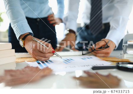 Businessman and businesswoman in office analyze autumn plan. Businessman and businesswoman in office analyze autumn plan. 67433715