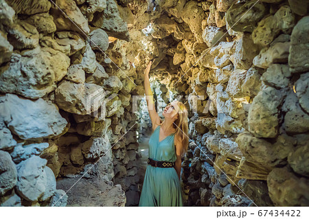 Woman tourist in Chua Tu Van temple made of shells and corals or the dragon maze. Travel to Vietnam Concept Woman tourist in Chua Tu Van temple made of shells and corals or the dragon maze. Travel to Vietnam Concept 67434422