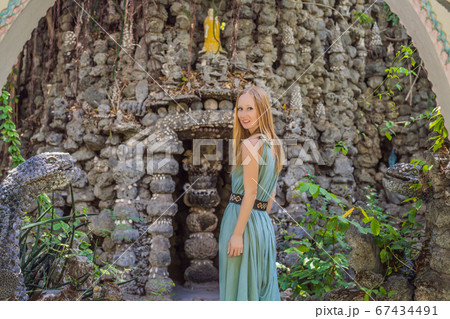 Woman tourist in Chua Tu Van temple made of shells and corals or the dragon maze. Travel to Vietnam Concept 67434491