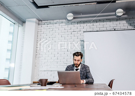 serious business man in his own office 67434578