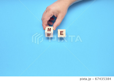 Teamwork concept. Hand turns dice and changes the 67435384