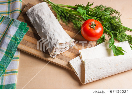 Pita bread or lavash wrapped with cottage cheese Pita bread or lavash wrapped with cottage cheese 67436024