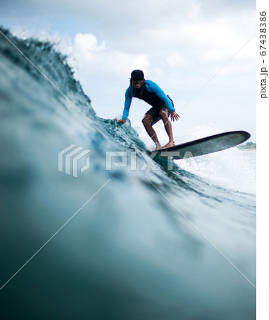 surfer riding a wave 67438386