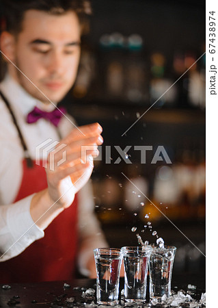 Bartender White Shirt Adding Transparent Red Alcoholic Drink Measuring Cup  Stock Photo by ©Fesenko 199284042