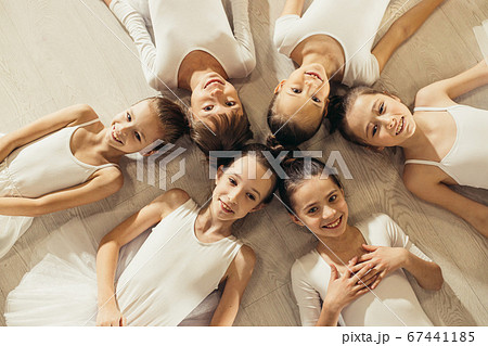 cute little girls ballerinas lying on floor in circle cute little girls ballerinas lying on floor in circle 67441185