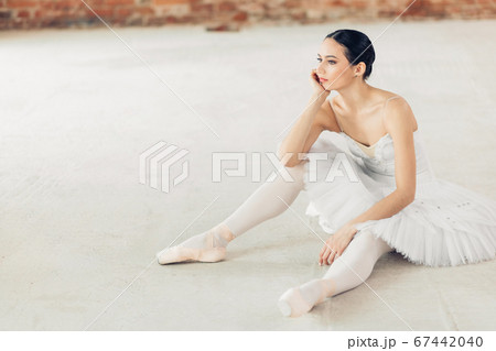 sad unhappy thoughtful girl resting in the studio after training sad unhappy thoughtful girl resting in the studio after training 67442040