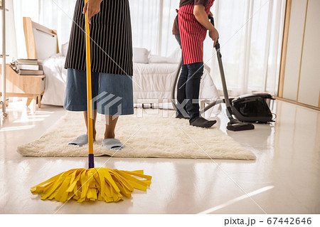 Clean bedroom by mop and vacuum cleaner 67442646