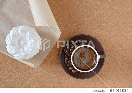 Espresso coffee and homemade meringue dessert on a cork napkin and text space. 67442854
