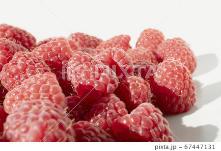 Fresh raspberries on grey background. Close up photo of sweet forest berries. 67447131