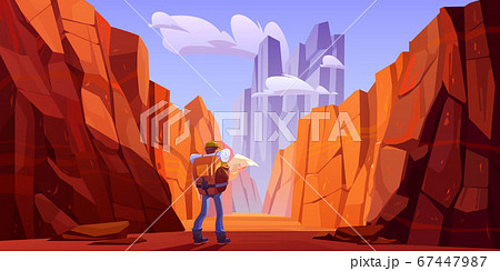 Hiker man with map on desert road in canyon 67447987