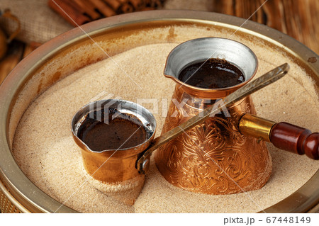 Process of preparation of coffee in turk in cezve on sand 67448149