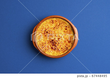 Creme brulee in clay tray top view. Burned cream 67448495