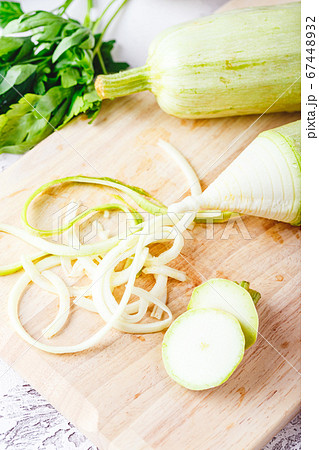 Zucchini Spaghetti on light background Zucchini Spaghetti on light background 67448932