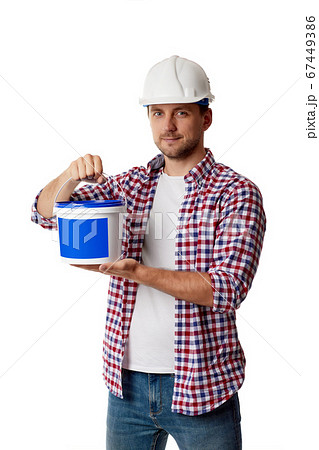 worker holding can with paint. worker holding can with paint. 67449386
