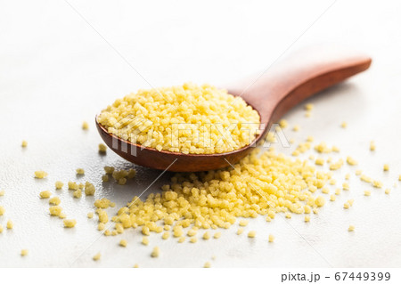 Dry yellow couscous Dry yellow couscous 67449399