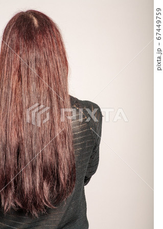 rear view of red haired girl with long straight hair 67449759