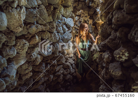 Woman tourist in Chua Tu Van temple made of shells and corals or the dragon maze. Travel to Vietnam Concept Woman tourist in Chua Tu Van temple made of shells and corals or the dragon maze. Travel to Vietnam Concept 67455160