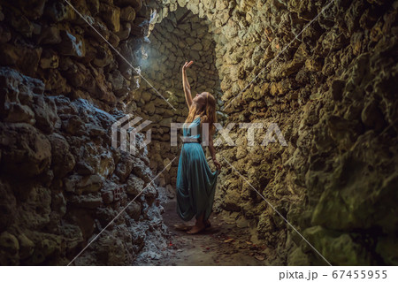Woman tourist in Chua Tu Van temple made of shells and corals or the dragon maze. Travel to Vietnam Concept Woman tourist in Chua Tu Van temple made of shells and corals or the dragon maze. Travel to Vietnam Concept 67455955