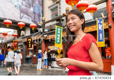 China food market tourist woman walking using phone on Beijing hutong street travel vacation adventure. City lifestyle young Asian girl. Asia summer travel destination. Girl traveling Asia chinatown China food market tourist woman walking using phone on Beijing hutong street travel vacation adventure. City lifestyle young Asian girl. Asia summer travel destination. Girl traveling Asia chinatown 67456854