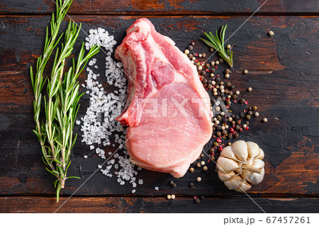 Raw meat on dark wood rustic background. Bio 67457261