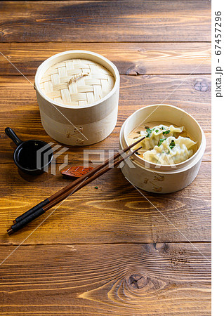 fresh boiled gyoza dumplings in wooden steamer fresh boiled gyoza dumplings in wooden steamer 67457296