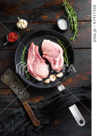 Fresh raw pork meat on frying grill pan with Fresh raw pork meat on frying grill pan with 67457306